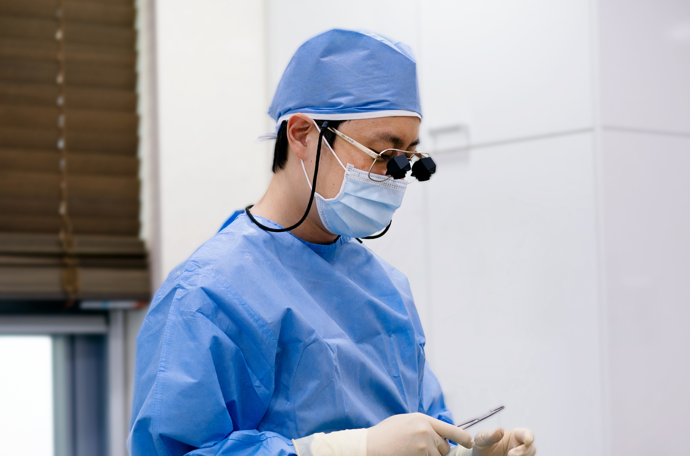 Clinician wearing protective glasses during a procedure