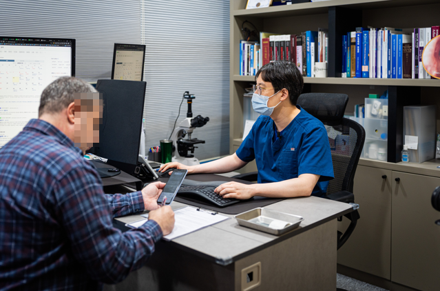 Urologist discussing information with a patient