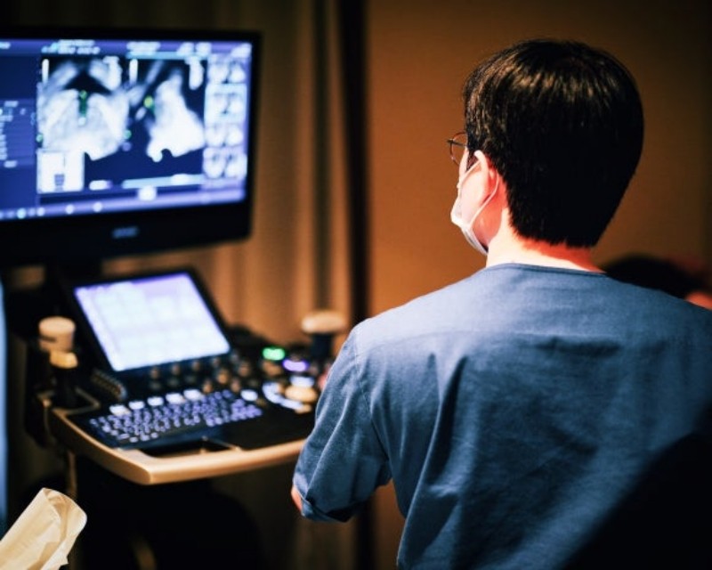 Clinician reviewing images on an ultrasound machine