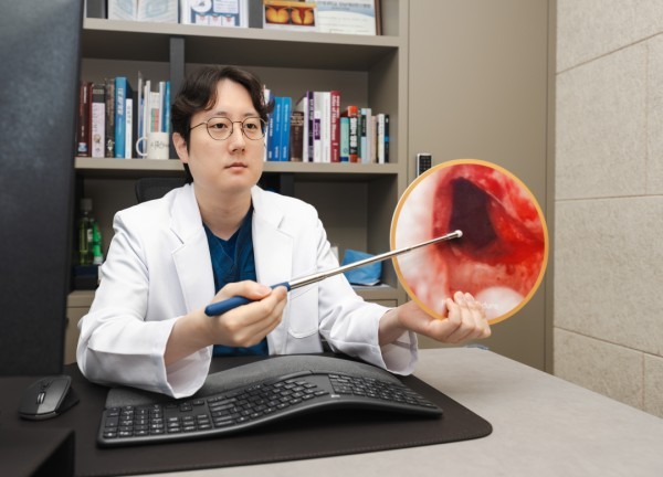 Urologist explaining a medical model