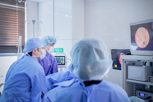 Medical team monitoring an endoscopic procedure