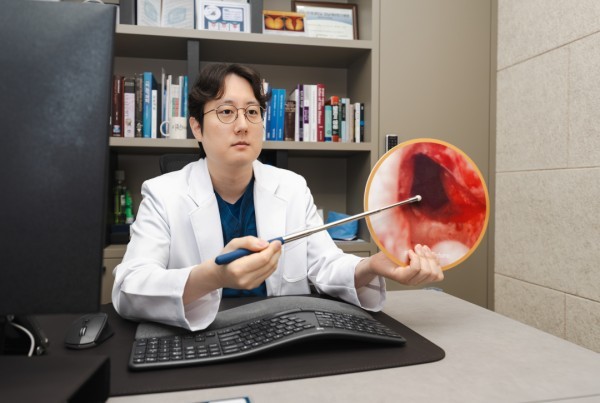 Urologist demonstrating a medical model