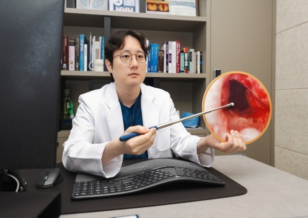 Urologist demonstrating a medical model