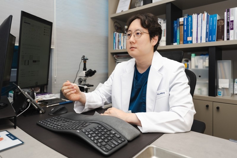 Urologist in a white coat explaining information during a consultation