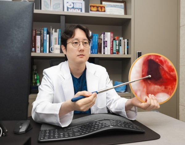 Urologist demonstrating a medical model