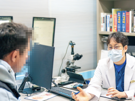 Urologist discussing examination findings with a patient