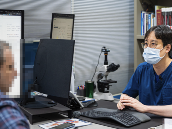 Urologist reviewing information with a patient